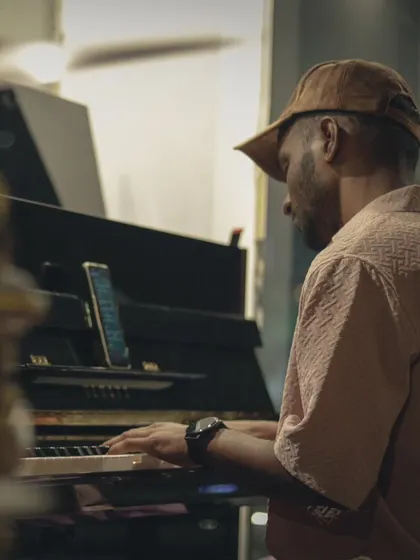 A pianist setting a mellow, contemplative mood. Our Yamaha upright piano is perfect for everything from classical pieces to jazz standards and pop ballads.