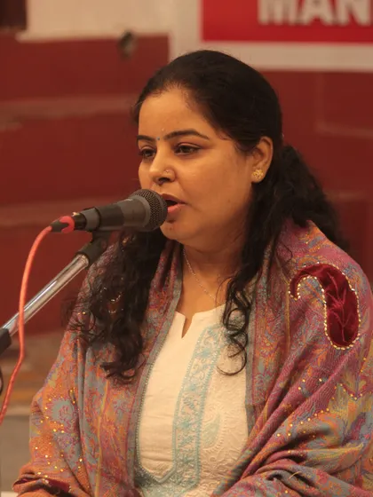 A student presenting her bhajan with grace and confidence.
