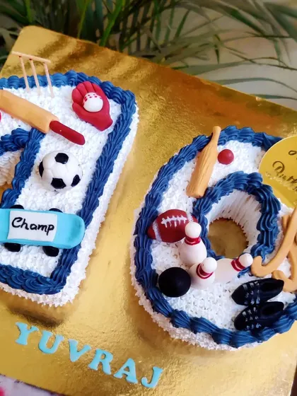 A cake for a true sports champ turning ten! This number cake is decorated with all his favorite sports, from cricket and football to bowling and skateboarding, all made from fondant.