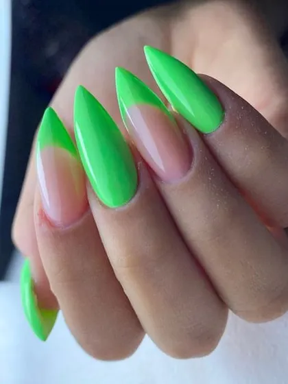 Another look at our neon green French tip design on stiletto nails. This high-contrast look is edgy and unmissable.
