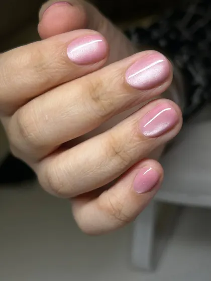 A soft, baby pink cat-eye manicure. The subtle magnetic shimmer adds a delicate, magical glow to this sweet and feminine color.