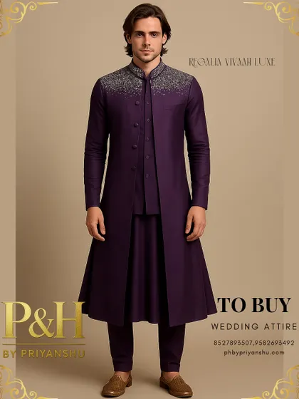 I designed this layered ensemble for the modern groom who seeks a blend of tradition and contemporary flair. It features a deep purple Anarkali-style kurta under a structured half-jacket and a long, flowing top jacket, crowned with brilliant silver hand-embroidery on the collar and shoulders.