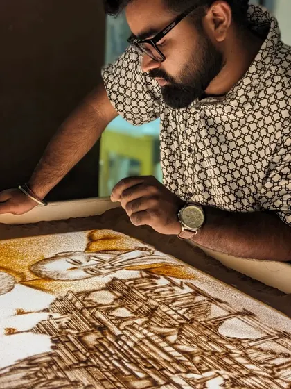 A moment of concentration while creating the Ram Mandir sand art. My studio is my sacred space.
