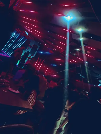 The impressive laser and light show at a club gig, showing the high-quality production I work with.