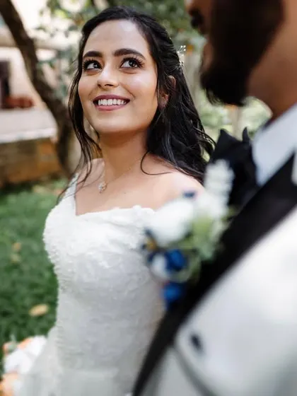 A bride looking radiant in her white wedding gown. We are experienced in capturing the beauty and traditions of Christian weddings.
