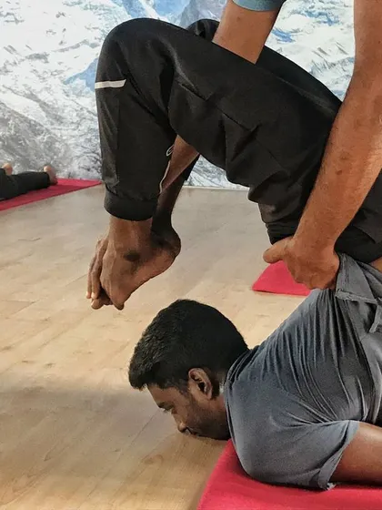 This was during my teacher training. Another teacher, Regeesh, saw my potential and stepped in to help me find more depth in the pose. Every teacher offers a new perspective.