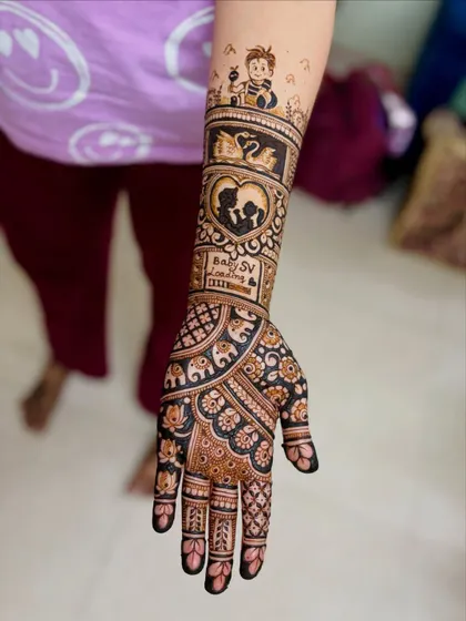 A single-hand view of a baby shower design, showcasing the combination of traditional patterns on the palm and personalized story elements on the arm.