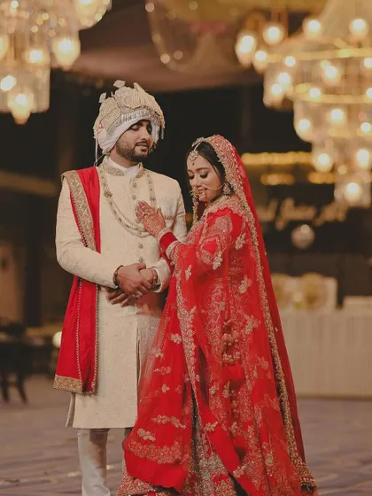 My gorgeous bride with her groom. The grandeur of the chandeliers adds to the royal feel of this picture.