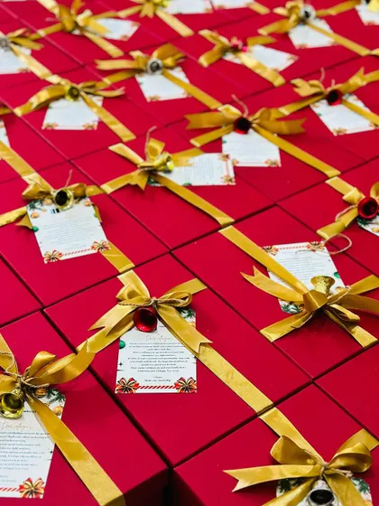 A large order of our signature red and gold gift boxes, meticulously prepared to ensure a consistent and high-quality gifting experience.