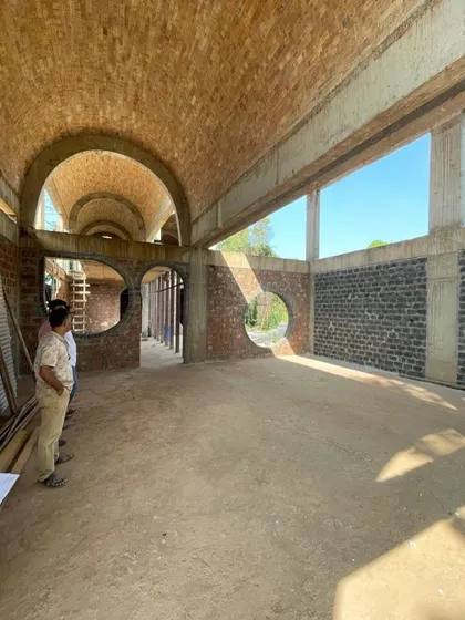 The interior of the House of Verses under construction reveals the scale of the brick vaults and the quality of light they create. These moments on site are crucial for ensuring the built form aligns with our initial poetic vision.