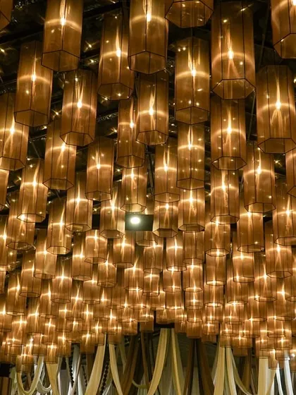 A different angle of the stunning lamp canopy, showing the density and scale of the installation. It's a design that completely transforms the perception of the space.