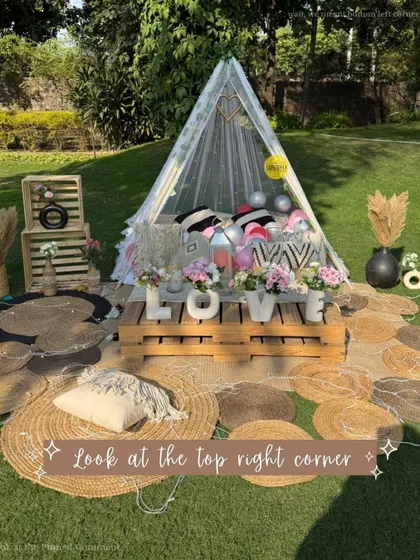A beautiful boho picnic setup with a "LOVE" centerpiece, perfect for Valentine's Day, an anniversary, or a surprise proposal. The mix of textures and natural elements creates a warm and inviting feel.