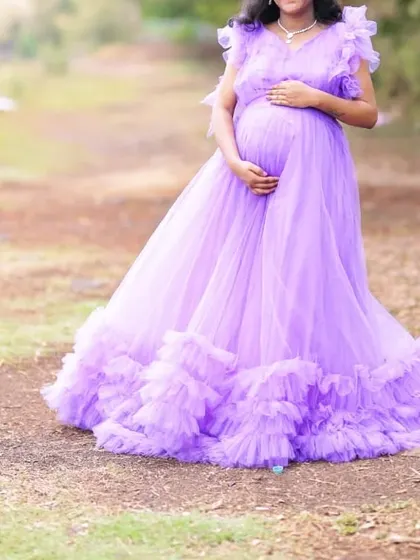 A beautiful dark lavender ruffle gown, perfect for an outdoor maternity or pre-wedding photoshoot. The color is unique and looks stunning in natural light.