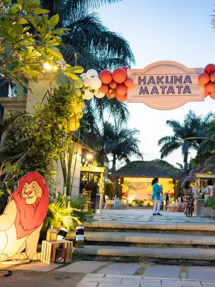 The grand entrance to the "Hakuna Matata" celebration, featuring a large Mufasa cutout and a custom sign, set the stage for a memorable Lion King adventure.