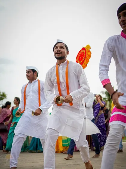 Devotees dance with cymbals during the Ashadhi Ekadashi procession. The celebration is a dynamic and moving expression of their love for the divine.