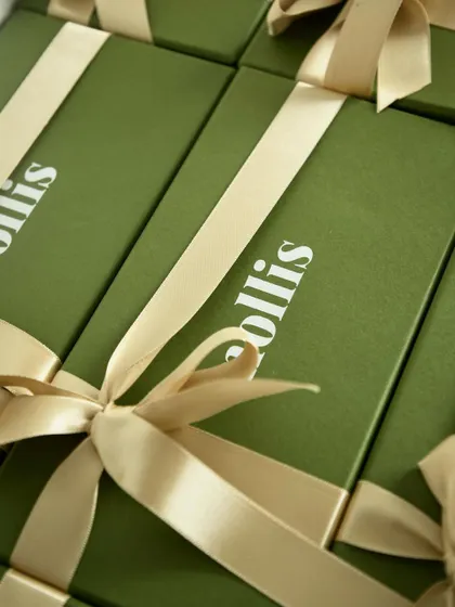 A close-up of the finished Rakhi gift boxes, tied with a perfect bow.