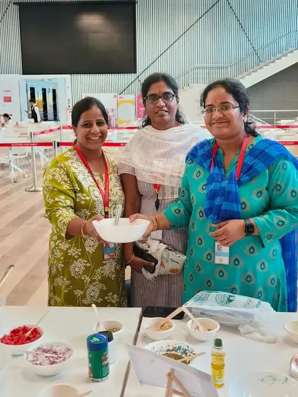 It's always wonderful to see employees enjoying the healthy treats they've made themselves. These women are proudly showing off their creations from our no-cook salad workshop, a popular activity at our corporate wellness events.