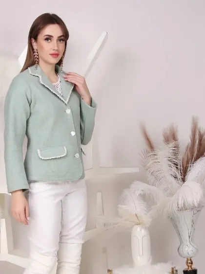 A chic mint green blazer styled for a semi-formal look. This type of photography is ideal for brands targeting working professionals or those seeking sophisticated casual wear.