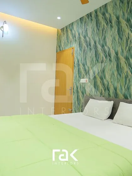 Another view of the nature-inspired bedroom, showing the simple yet effective design of the bed and side table.