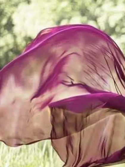 This image captures the essence of our flying gowns. The lightweight purple fabric billows gracefully, showing the kind of movement and drama you can achieve for a truly spectacular pre-wedding photo.