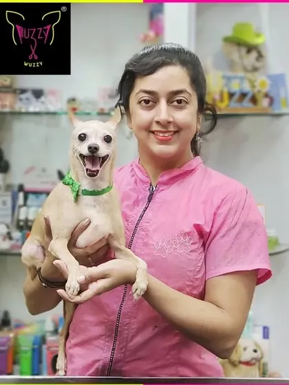 Look who's smiling. Ginger the Chihuahua mix is showing off a huge grin after being pampered at the spa.