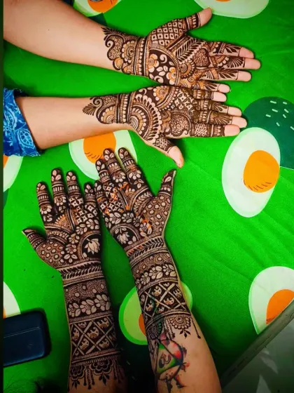 Another view of the group mehandi, showing different designs on different hands.