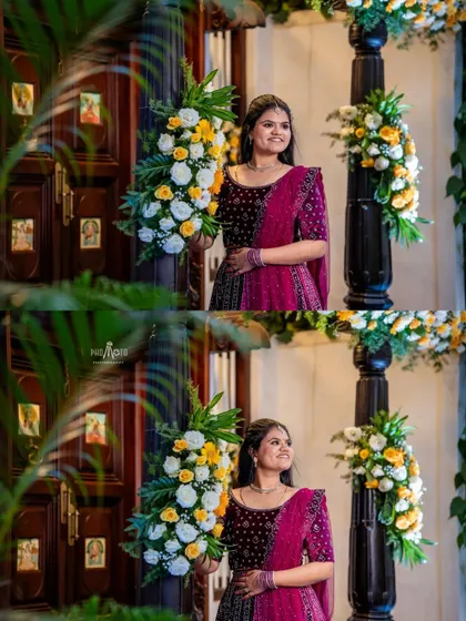 A lovely portrait of the bride standing next to beautiful floral arrangements at the reception venue.