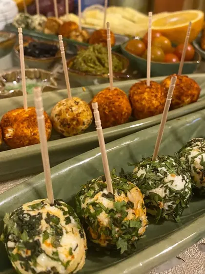 A beautiful arrangement of our mini cream cheese rolls on skewers, featuring flavours like Paprika Garlic and Parsley Walnut, making them an easy-to-serve party appetizer.