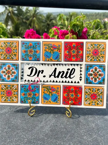 A beautiful nameplate with vibrant, hand-painted tile designs, perfect for adding a touch of traditional art to the entrance of a home.