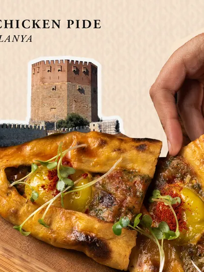 Our Chicken Pide is a taste of Alanya. This boat-shaped flatbread is a savory and satisfying dish, showcasing the rustic and delicious side of Turkish baking.