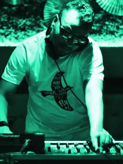 Lost in the music under a cool green light. This image captures the feeling of being one with the tracks I'm playing.