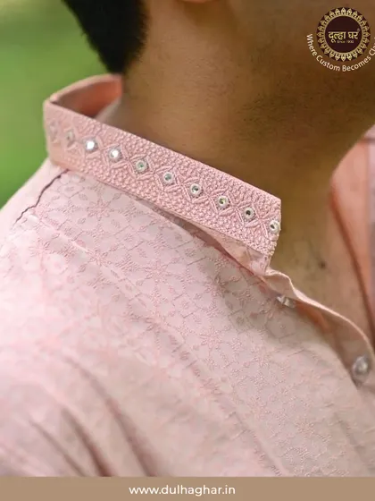 The beauty of my work is in the details. This close-up shows the delicate mirror and thread work on the collar of a pink kurta, a small touch of craftsmanship that makes the entire outfit unique and personal.