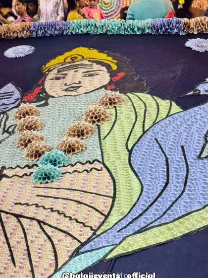 The floor covering for the pandal was also a large piece of art made from currency material, depicting a deity. I ensure that the decoration is immersive, covering every surface to create a complete experience for devotees.