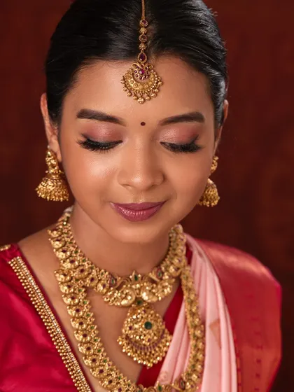 A close-up of the makeup and jewellery, showing how well the pieces complement a soft glam look.