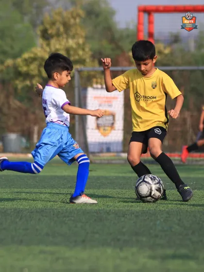 A young player from our U7 team dribbling past a defender in the Leno Premier League.