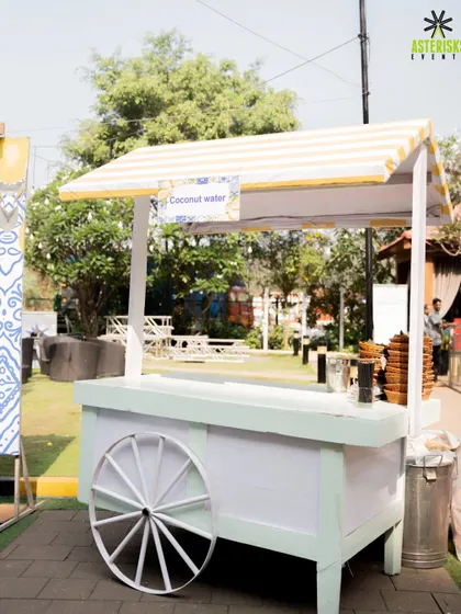 A charming coconut water cart at a Haldi celebration. We add thoughtful details like themed refreshment stations to keep guests cool and enhance the overall event experience.