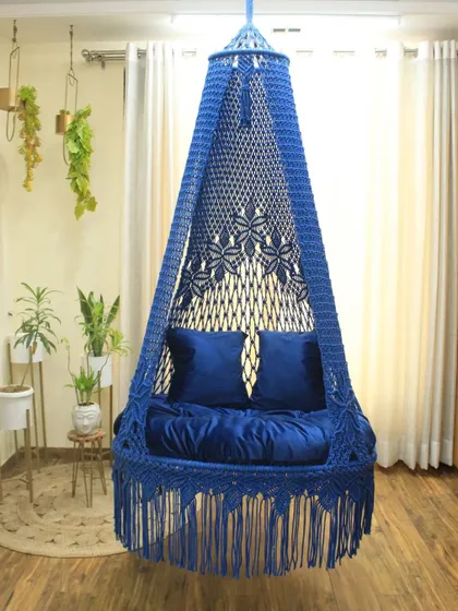 This royal blue single seater swing is perfect for adding a touch of elegance. The intricate floral pattern on the canopy is a testament to our detailed handwork.