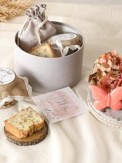 A handcrafted hamper featuring our Orange & Almond Tea Cake Loaf, crunchy Sichuan Peanuts, and a jar of fudge cookies. A perfect mix of sweet and savory.