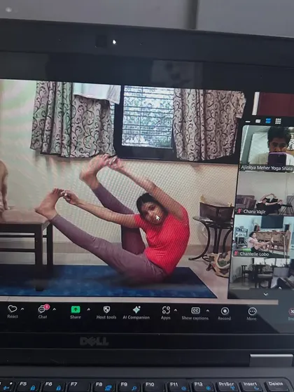 A student and her furry friend in our online class. One of the joys of practicing at home is having your pets join in.