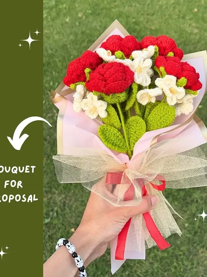 This bouquet of red roses and delicate white flowers is perfect for a proposal or any grand romantic gesture. It's designed to be unforgettable.