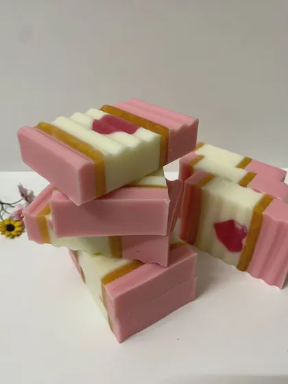 A stack of my pink heart soaps, showing the smooth texture and clean lines. These are perfect for gifting or adding a touch of love to your bathroom.