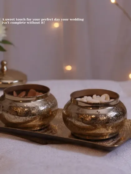 A sweet touch for your perfect day. These small, hammered brass bowls on a matching tray are ideal for serving dry fruits or small sweets to guests during wedding festivities.