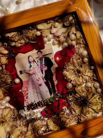 Another perspective of the silver jubilee frame, showing how the preserved flowers create a beautiful, textured border around the central photo.