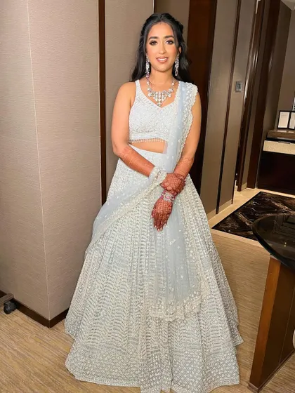 A full view of Sanskriti's elegant engagement look. The makeup is sophisticated and glamorous, perfect for an evening event.