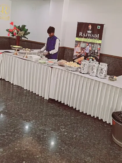 A closer look at one of my staff members preparing items at a live chaat station. We maintain high standards of cleanliness and presentation for all our food counters.