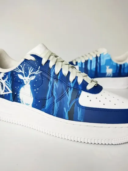 A full view of the mismatched Harry Potter custom sneakers. One shoe represents the mischievous side of the story, while the other captures its deep, emotional core.