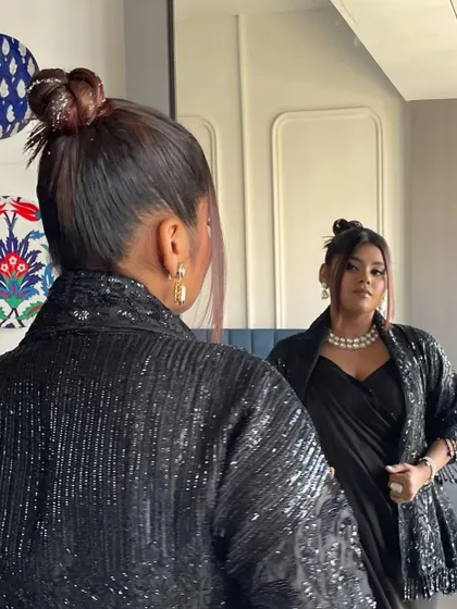 For Kajol Bafnaa, I created this glitter top knot to match her boss lady vibes. The glitter is woven into the bun itself for a cool, integrated sparkle.