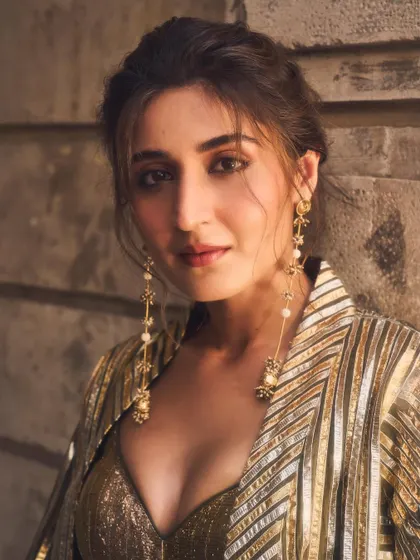 A soft, ethereal portrait of Dhvani. The lighting and her gentle expression perfectly capture the mood of this elegant, festive look.