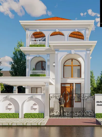 A frontal view of Mr. Praveen's residence, highlighting the symmetrical design and the grand entrance. This home is where luxury meets functionality, designed to embrace natural light and timeless aesthetics.