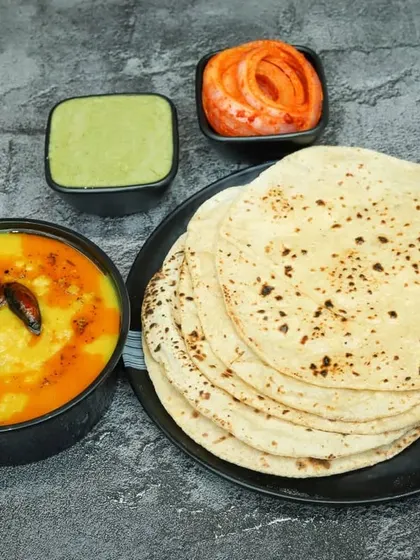 The simple yet unbeatable combination of Dal Tadka with soft, freshly made tawa rotis. This is the everyday meal that I grew up on and love to cook for you.